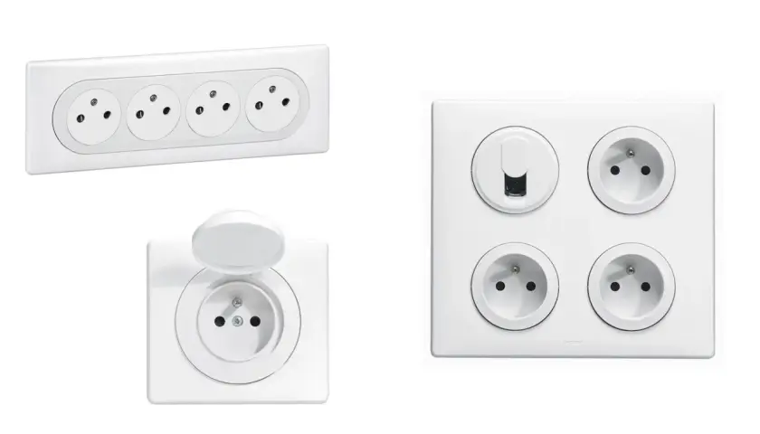Plusieurs prises électriques blanches, dont une avec volet, pour savoir combien de prise dans une chambre.